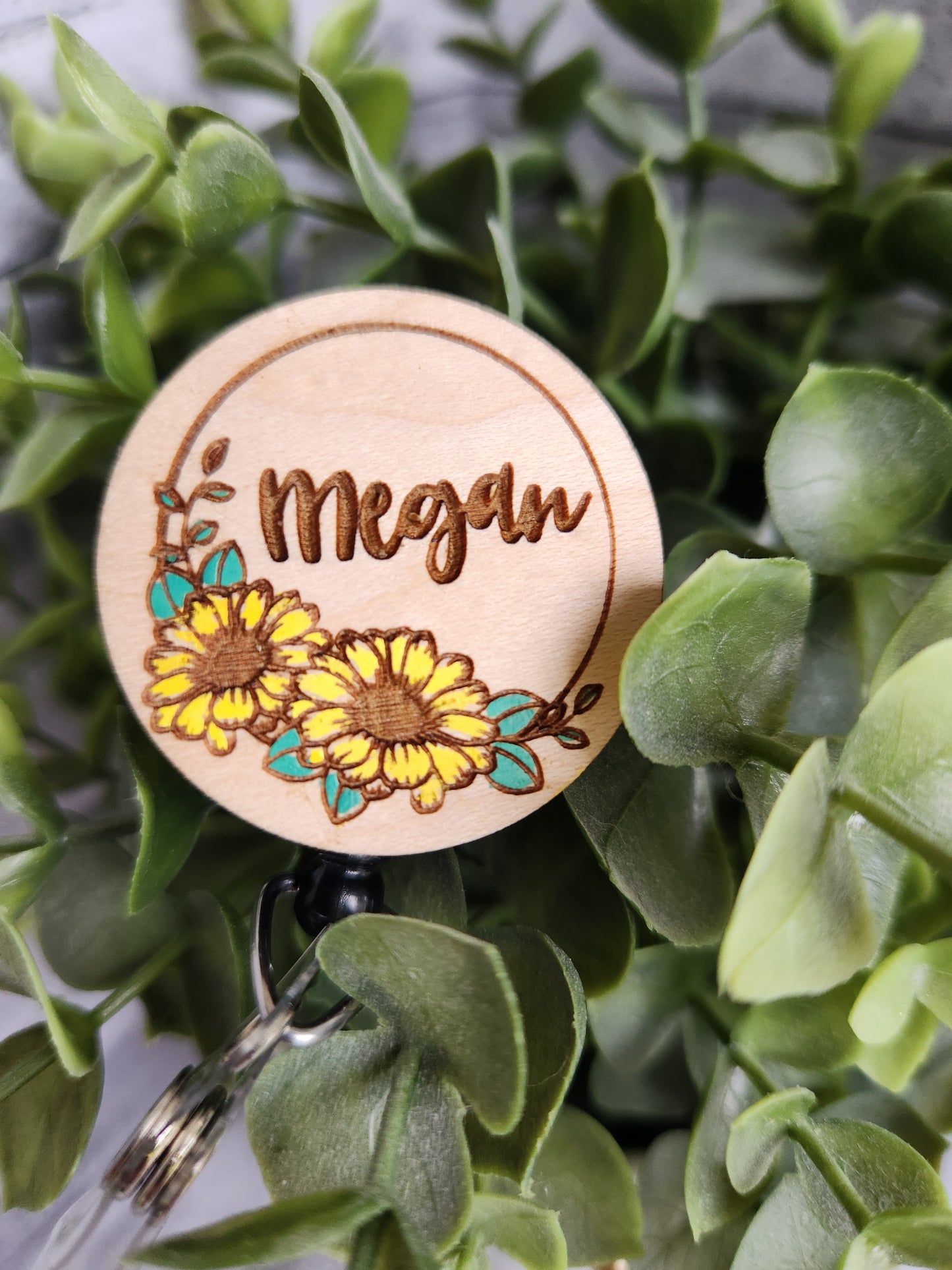 Wooden faced badge reel with name and sunflowers engraved