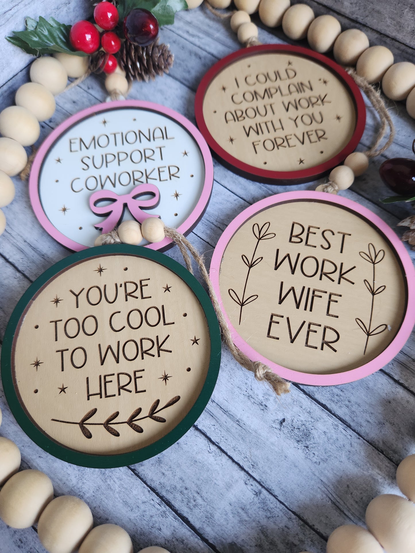 Decorative circular signs with motivational phrases on a wooden surface.