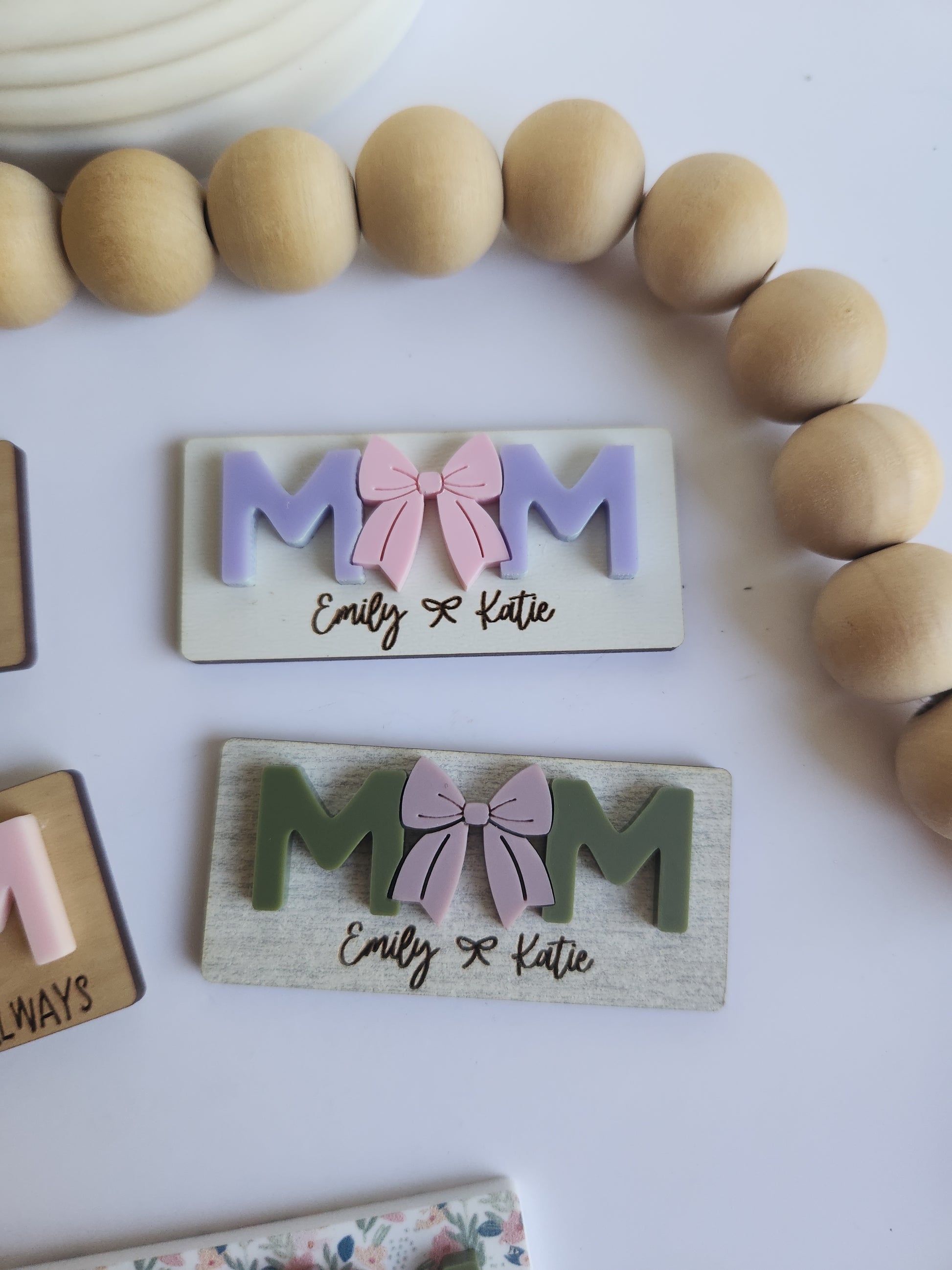 Wooden letter blocks with decorative elements on a white background