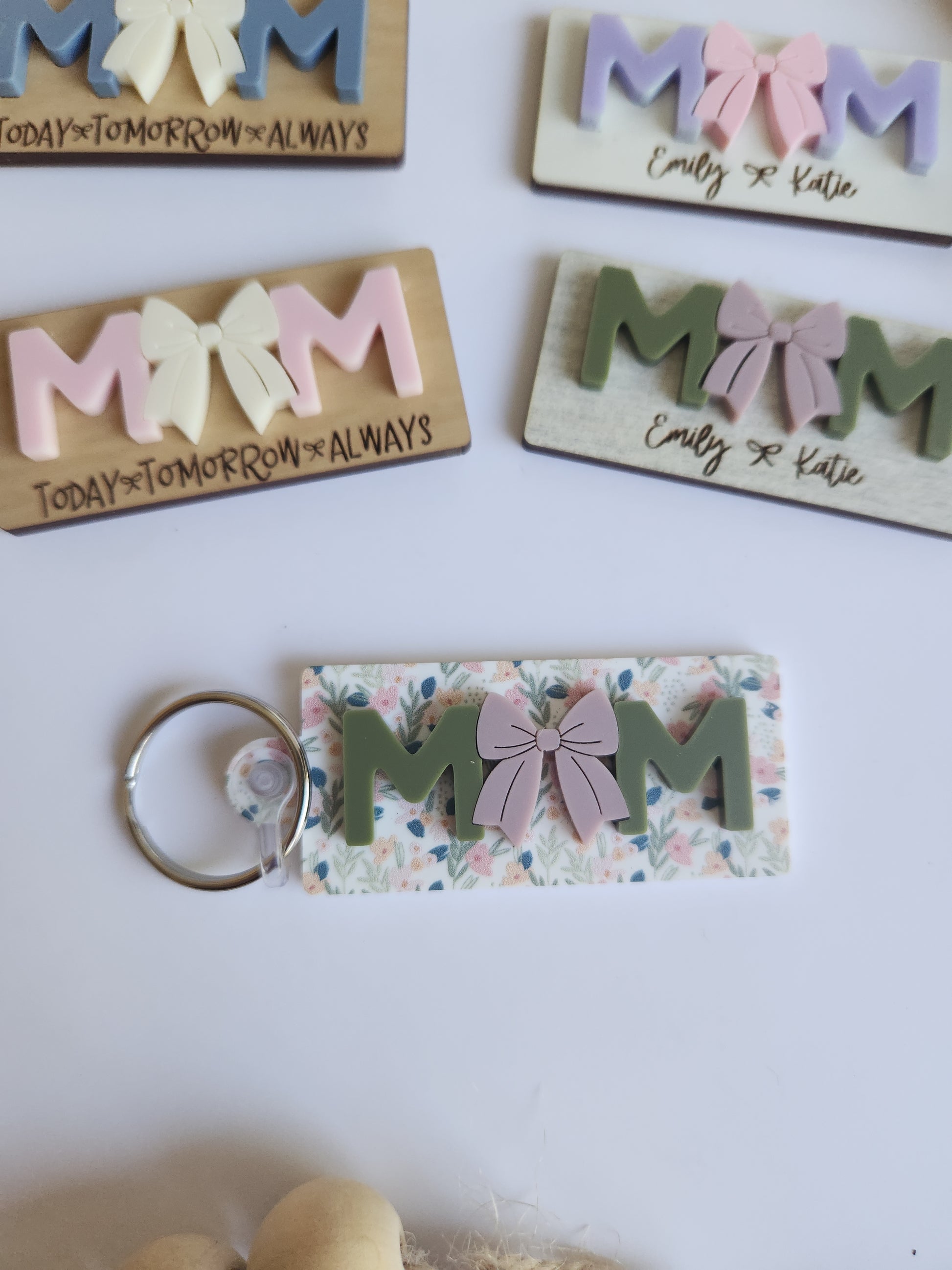 Set of personalized keychains with floral design on a white background